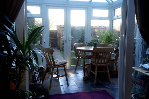 Inside conservatory with table and chairs