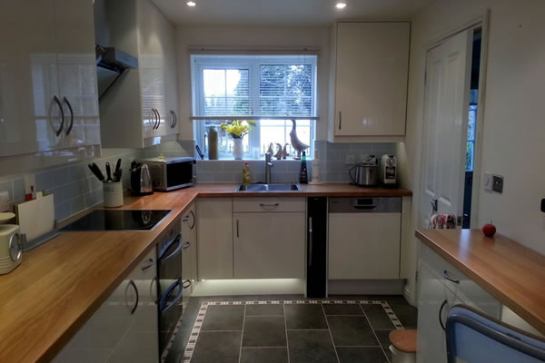 Wide-angle view of kitchen